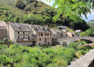 Row of stone buildings, one the Auberge des Cévennes in Le Pont-de-Montvert