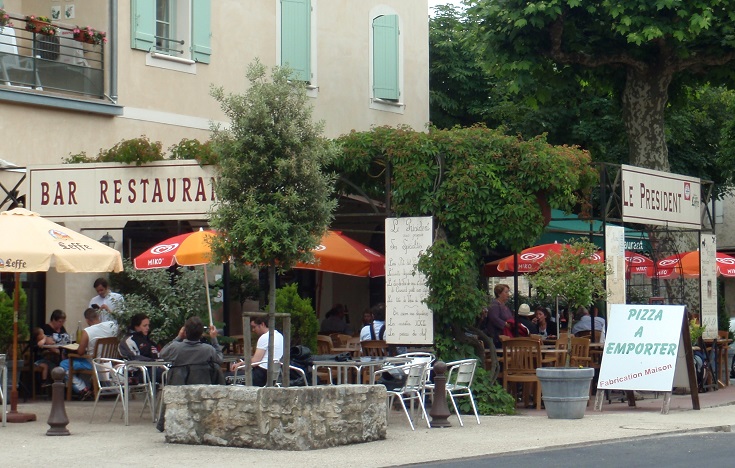 Diners in outdoor seating at Café le President, Cajarc