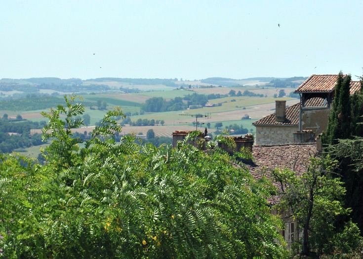 View including the edge of the chateau out into the rolling green hills of the countryside