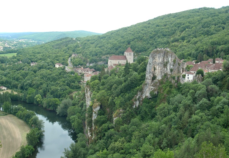 View of Saint-Cirq-Lapopie perched on a cliff above the River Lot