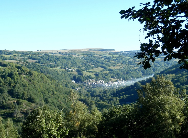View of Saint-Chély-d'Aubrac from the top of the ridge, the village nestles into the bottom of the valley