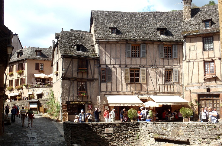 Colourful shops, busy with tourists, Conques
